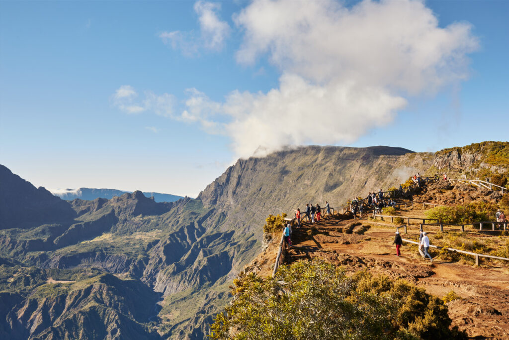 Piton Maido, La Reunion Island, France - August 15, 2017: Tourists on the Maido lookout overlooking Cirque of Mafate, listed as World Heritage by UNESCO, La Reunion Island, France.