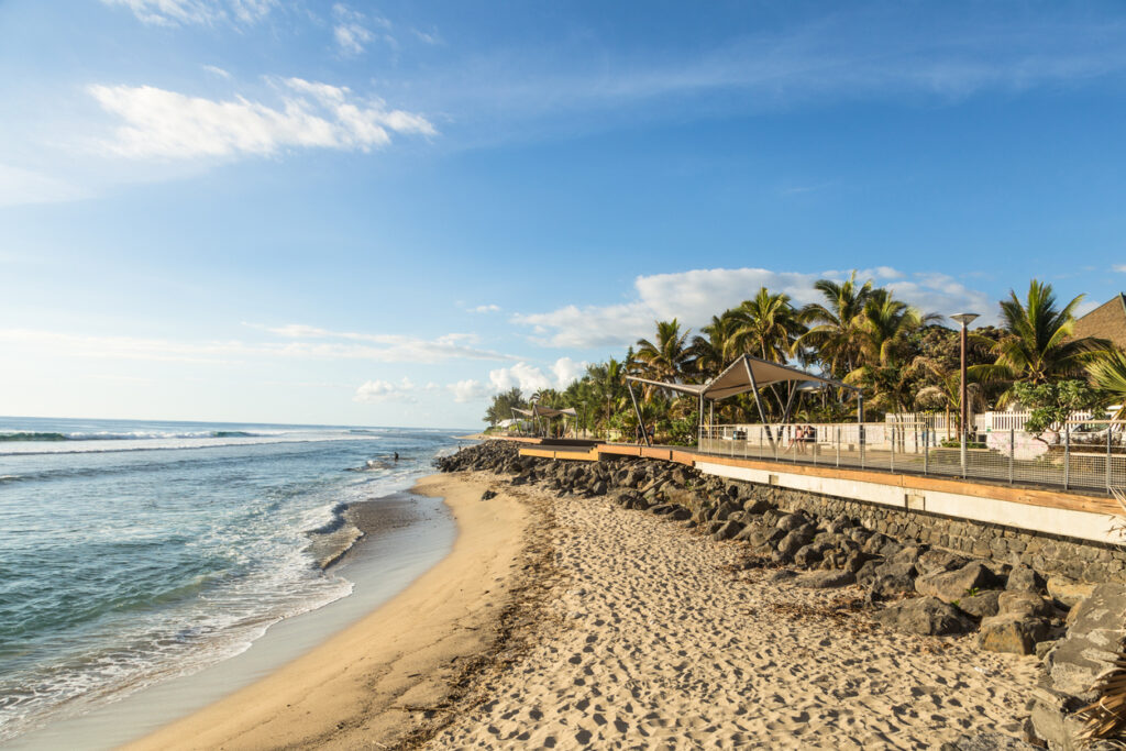 Early sunset over the beach in Saint Gilles les Bains, a famous resort town in the Reunion island, which belong to France in the Indian Ocean